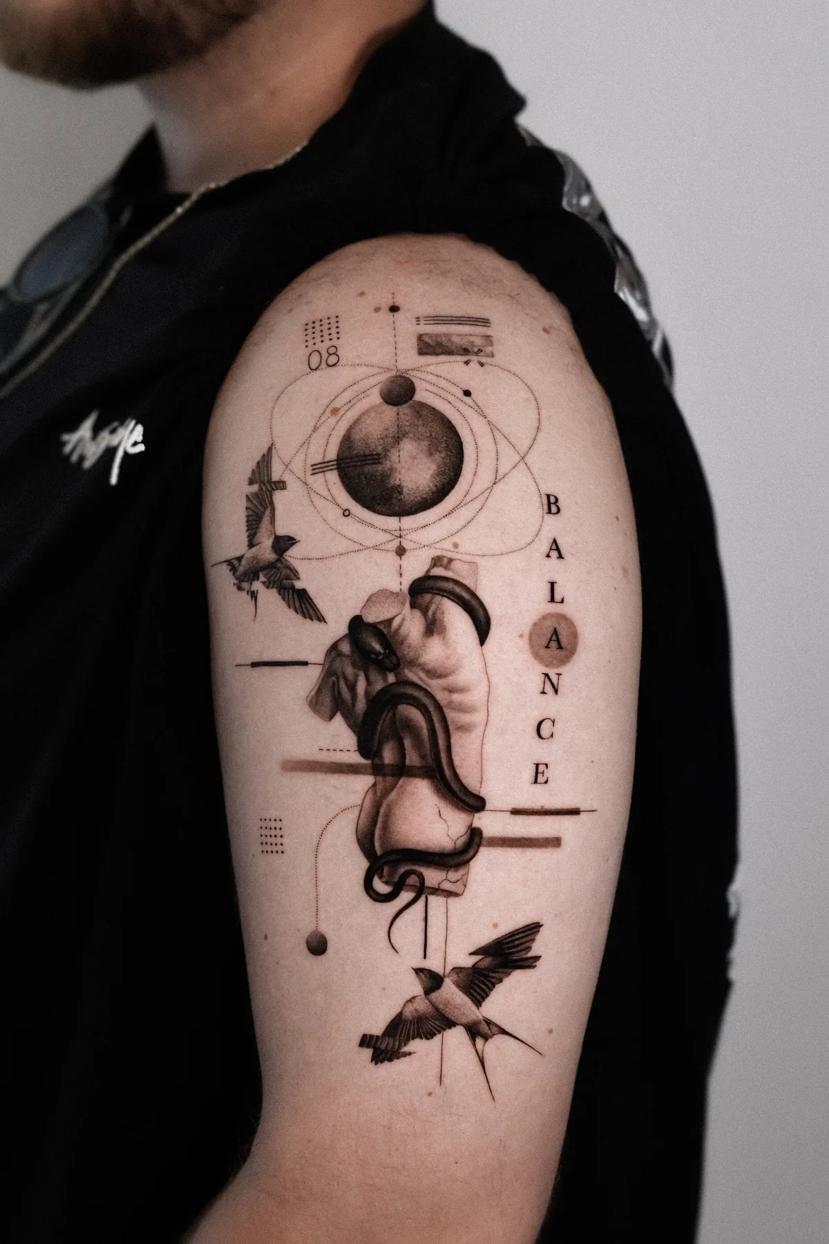 Statue with birds tattoo